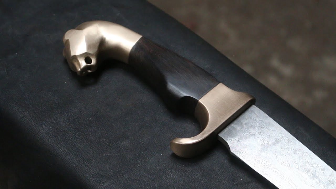 Forging a pattern welded Falcata, the complete movie.