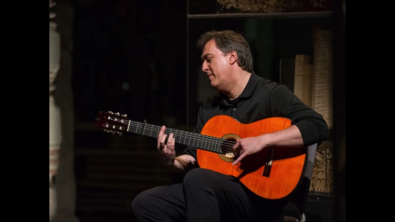 ANDRE CHARBONNEAU PLAYS ON GUITAR 