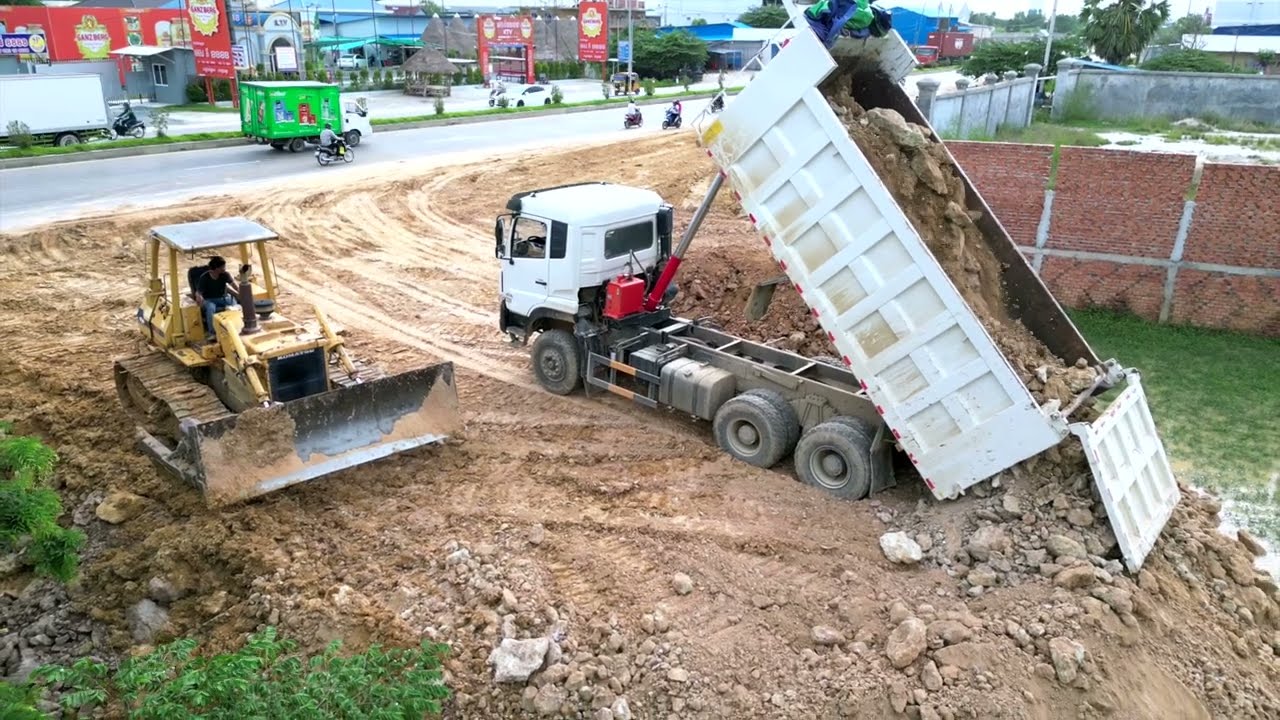 Awesone Landfillling Project: Bulldozer Pushing Dirt into Deep Long Area to Same Road Level
