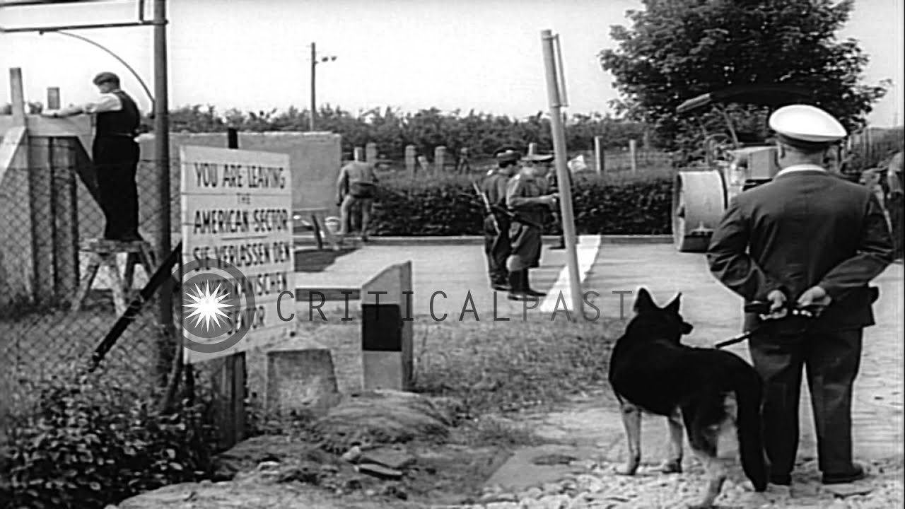 A barricade is raised at the site of the breach in the 