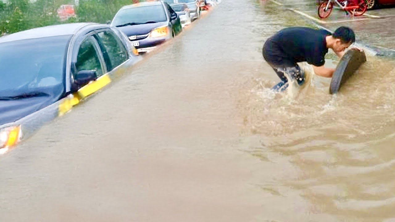 Watch This! Unclogging a Flooded Street Drain in Action!