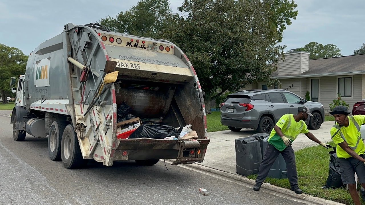 WM Mack MRU McNeilus Rear Loader Garbage Truck at The End of Manual Trash Collection