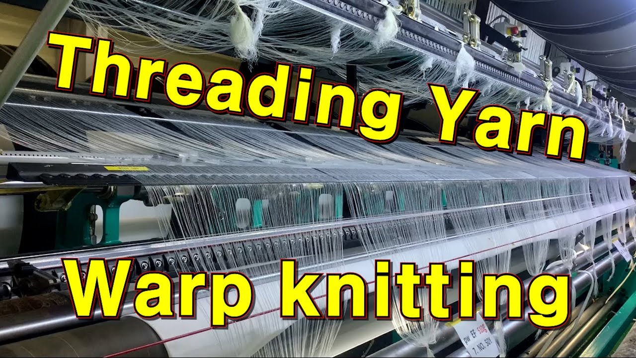 Threading yarn into the warp knitting machine guides. Tricot. warping machine. Karl mayer 트리코트 경편 편직