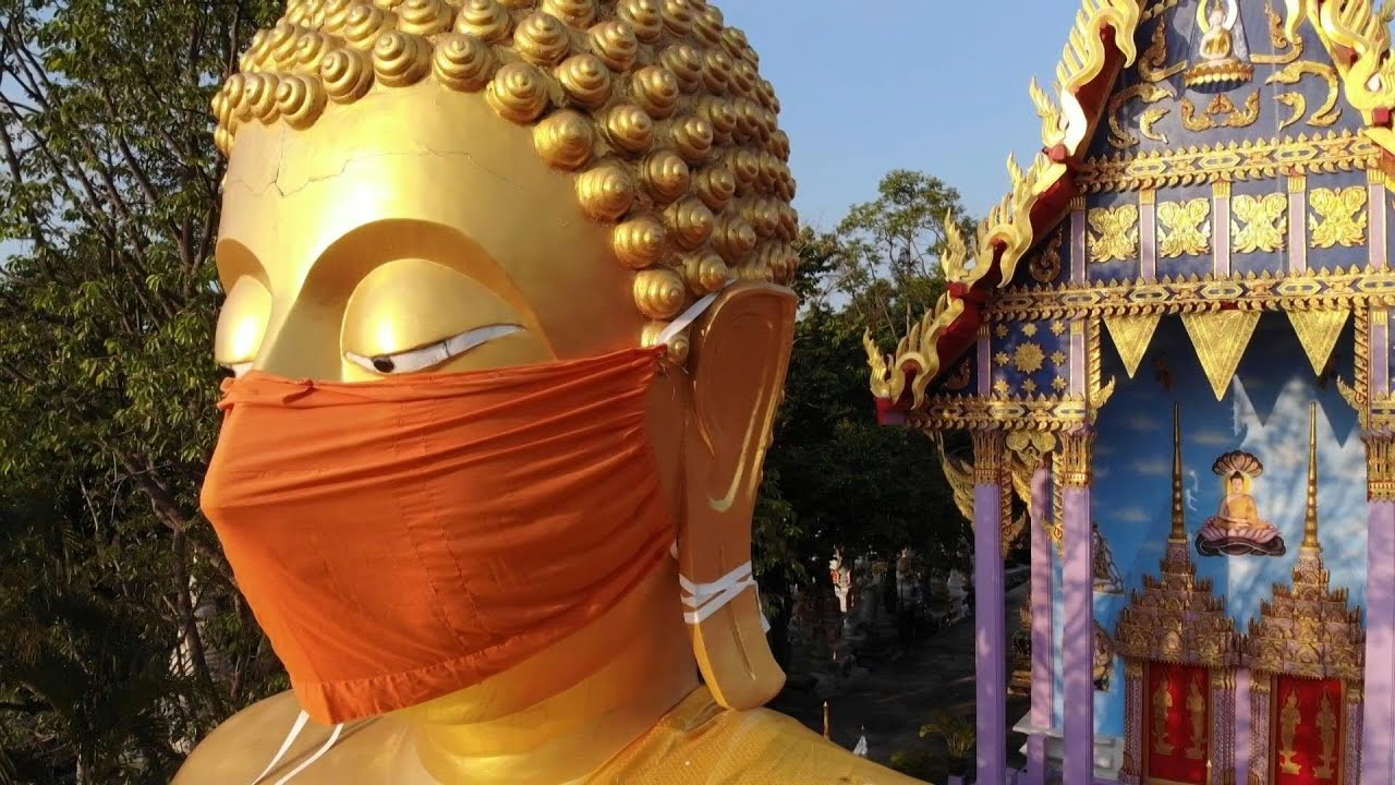 Thai temple puts face mask on giant Buddha statue | AFP