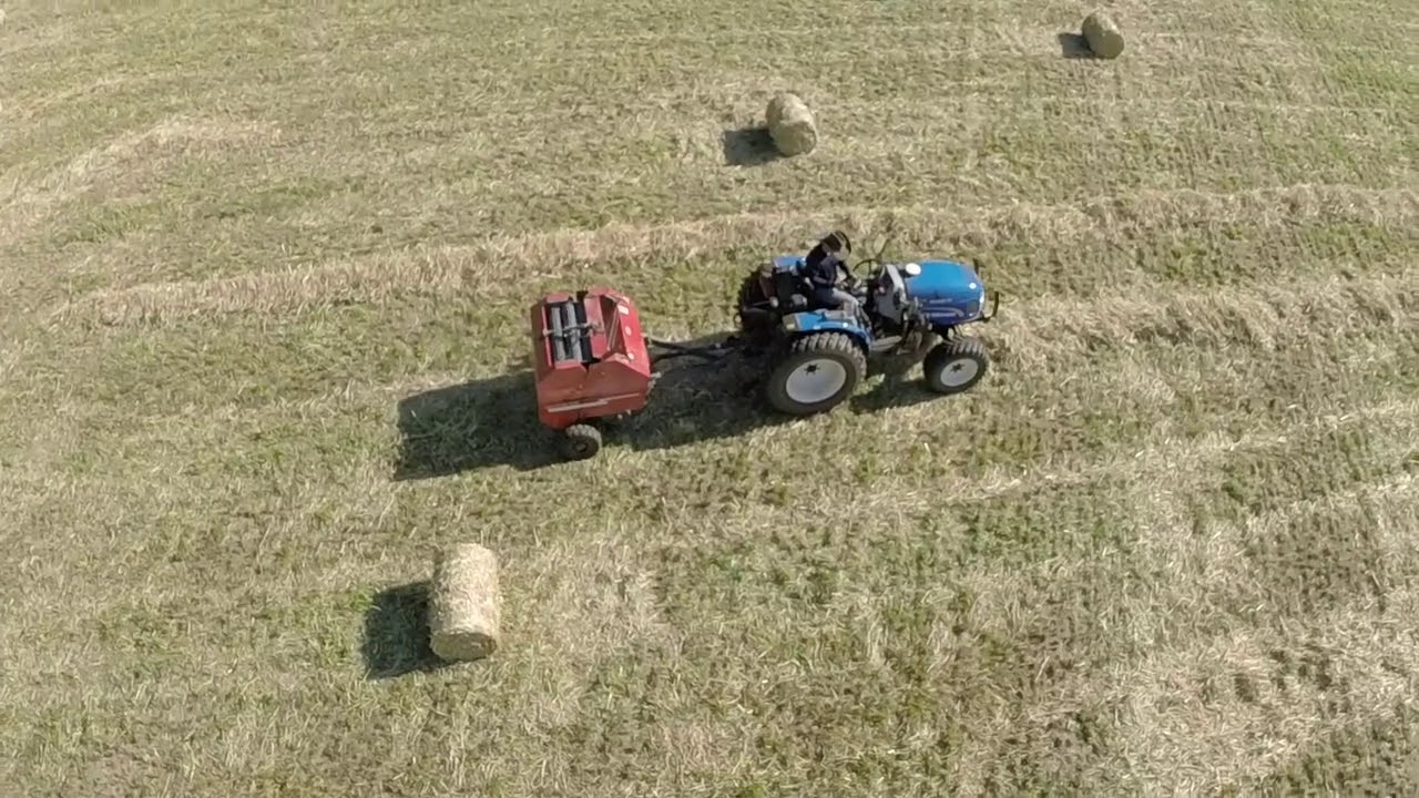 New Holland Boomer 50 Pressing Hay Bales filmed by Yuneec Q500 drone