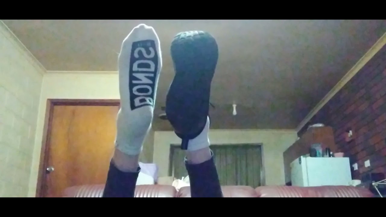Black vans and bonds white ankle socks removal with bare feet.