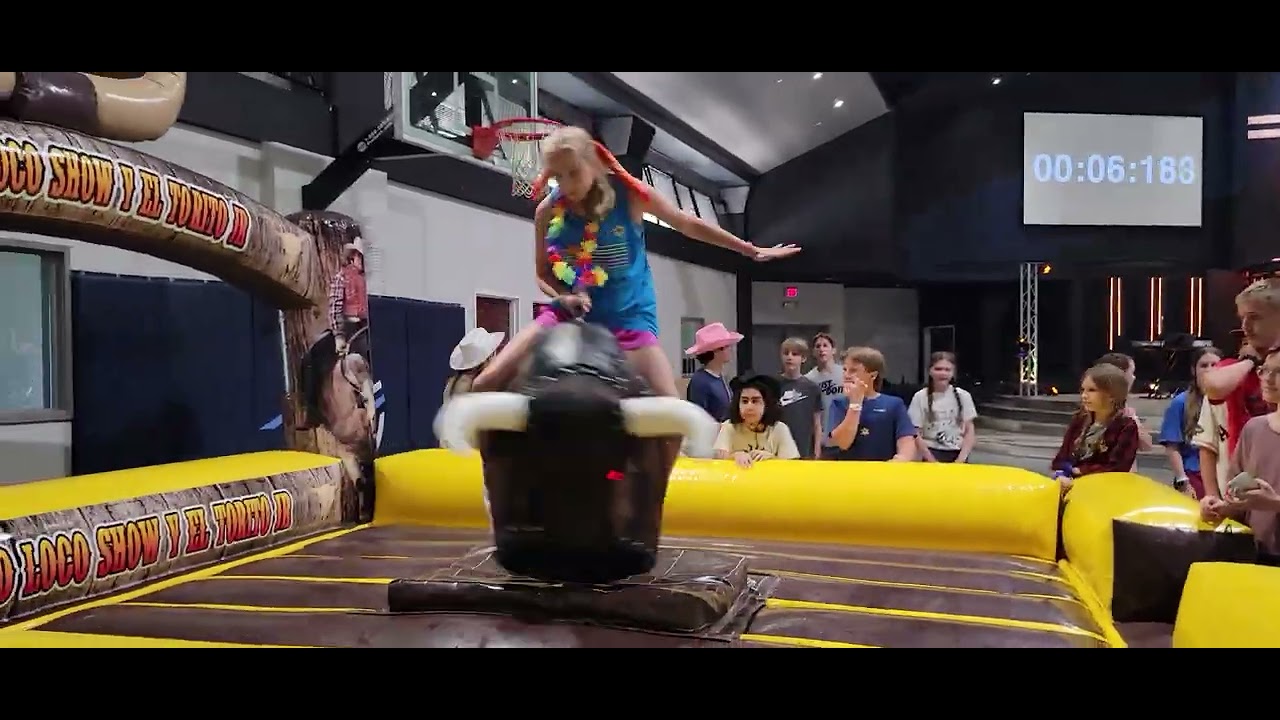 Middle School girls on  mechanical bull competition