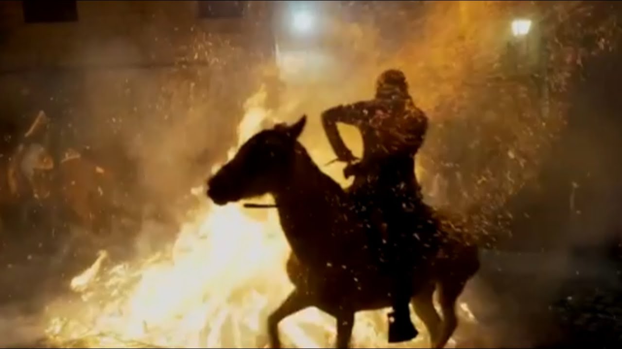 Horses gallop through flames in ancient Spanish tradition