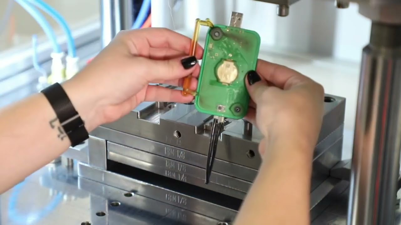 PCB overmolding, vertical insert molding,multi shot injection molding,vertical injection molded.