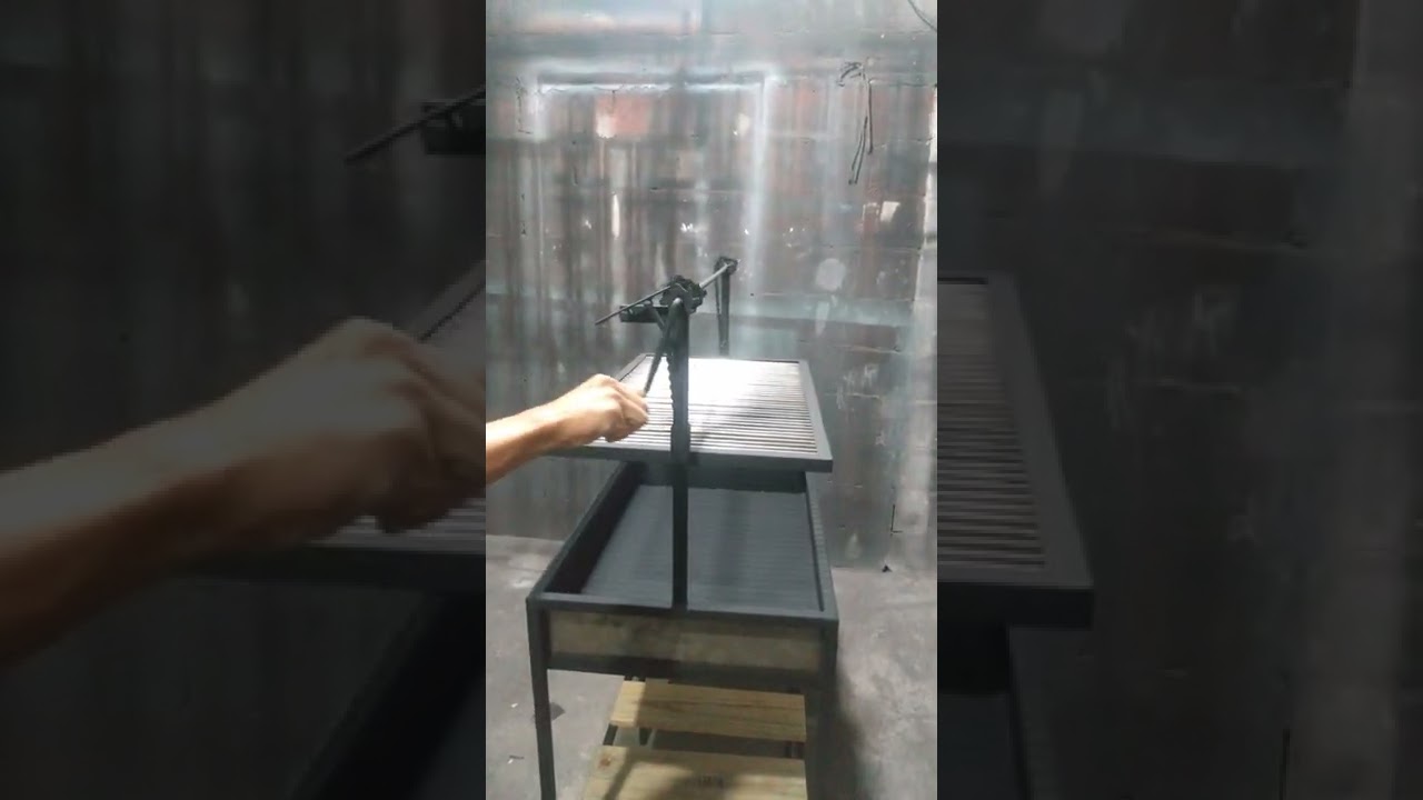 mecanismo para asador con parrilla elevadiza,