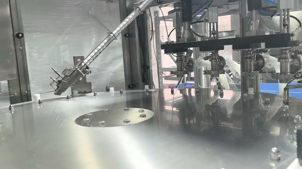 Liquid Packaging Solution | Rotary Spout Pouch Filling & Capping Machine