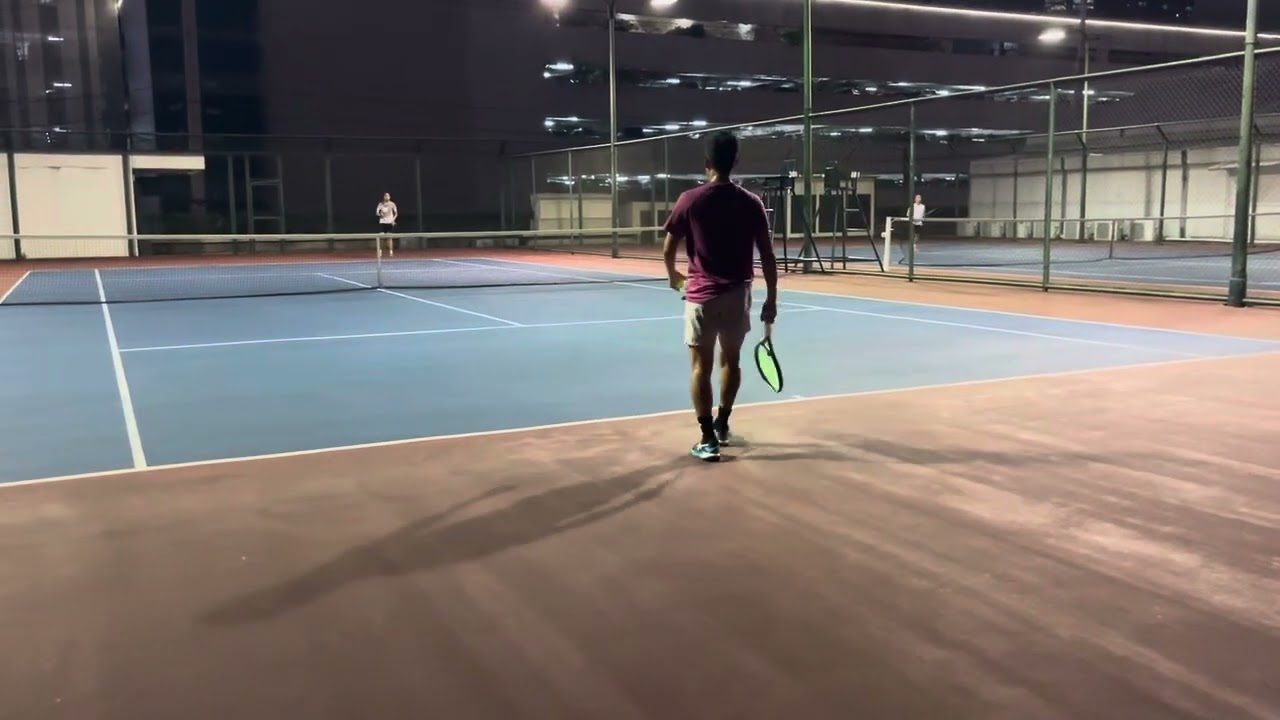 Manila, Philippines playing tennis on the roof of Shangri-La Hotel