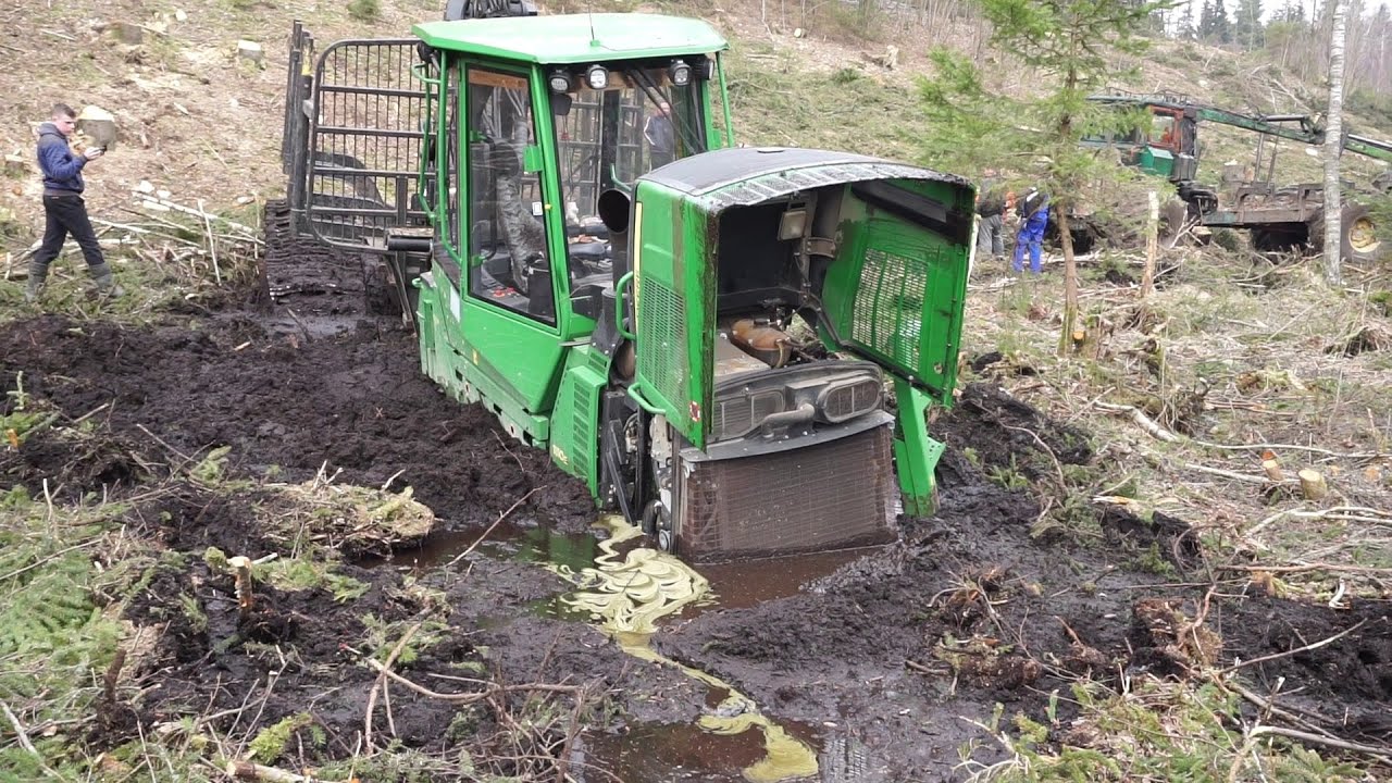 John Deere 1110E stuck deep in mud, saving with homemade forwarder
