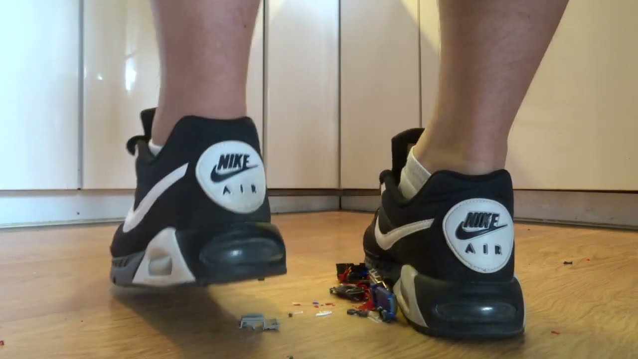 Nike Air Max Ivo stomp, trample and destroy some tiny model toy cars