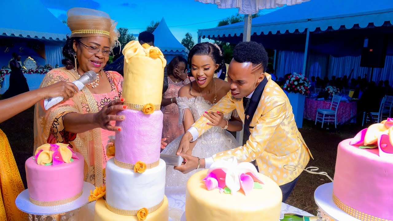 Stephen Kasolo and Grace Cake cutting during their wedding.