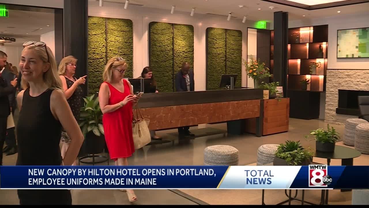 Workers at new Portland hotel wearing uniforms made by Maine company