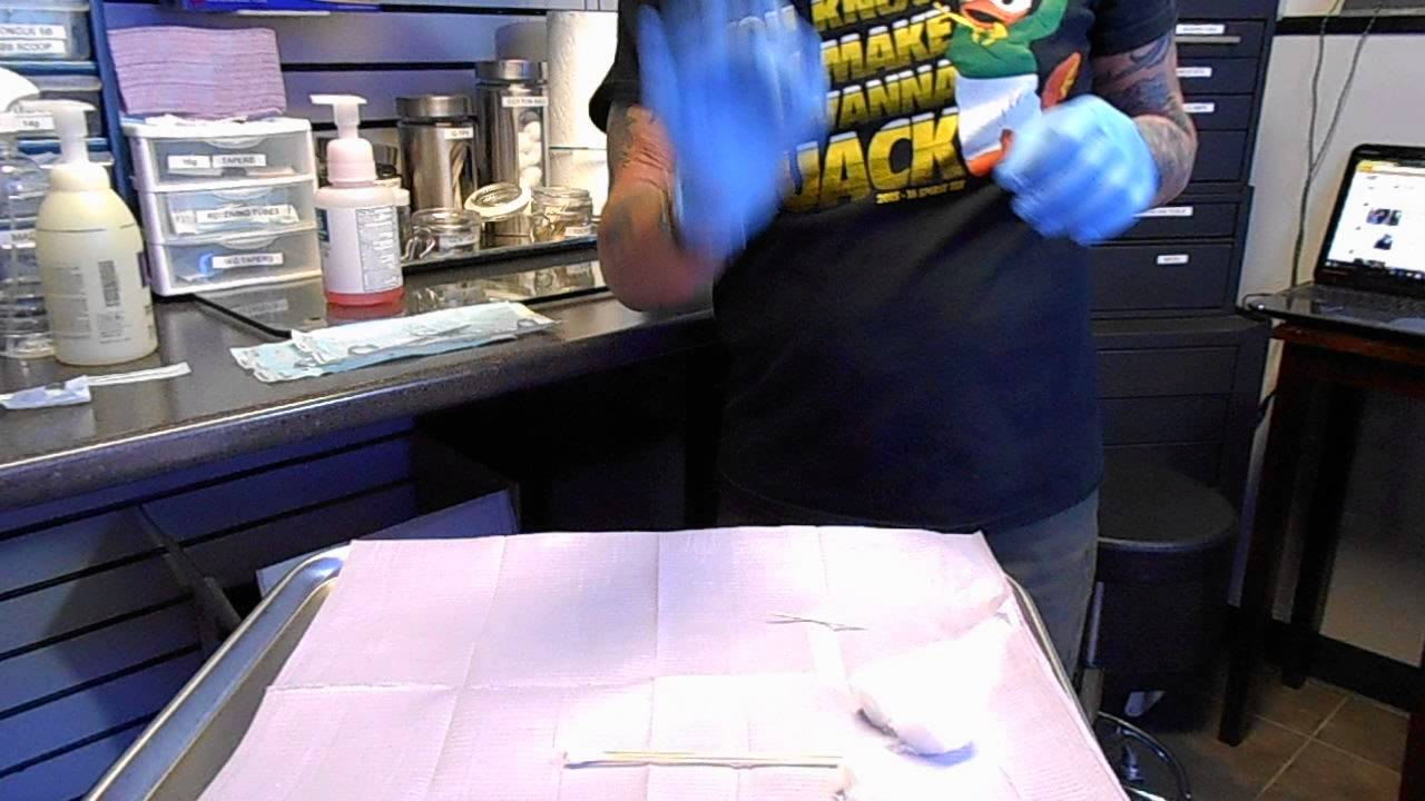 Sterile technique for setting up a navel piercing tray