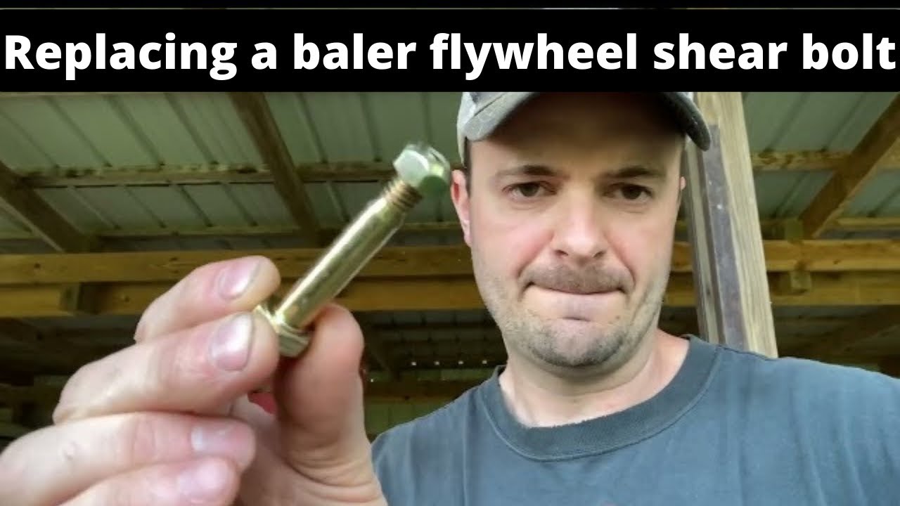 Replacing a flywheel shear bolt on a New Holland baler