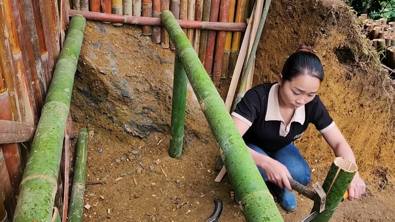 Survival experts built an underground shelter with a warm campfire. cooking and bushcraft