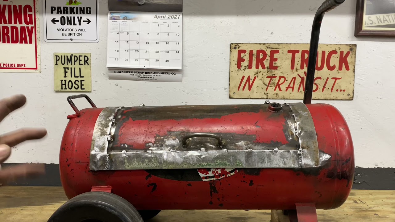 I made a mini-smoker/ grille out of an old air compressor.