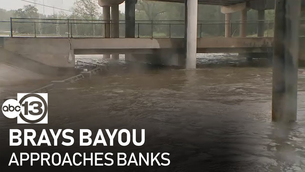 Brays Bayou approaches banks near Braeswood