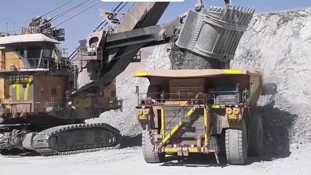 Loading Large Scale CAT 798AC and Komatsu 980E Extraction Trucks