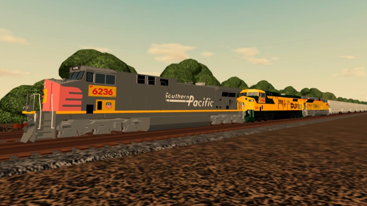 Chasing UP 6236 and UP 6706 leading on UP Grain Train with UP 8388 trailing in June of 2025