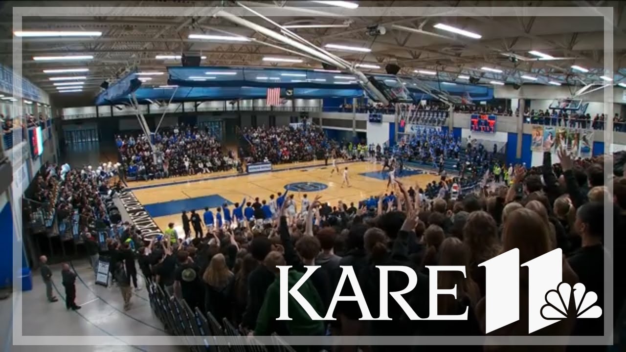High school basketball fans pack the stands at Wayzata-Hopkins matchup