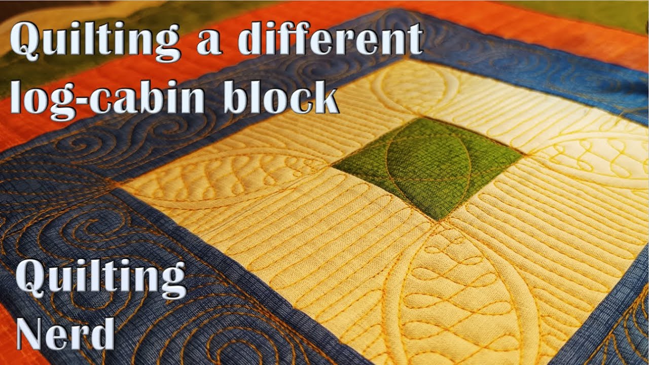 I gained some quilting experience points by quilting a deceptively simple log-cabin block