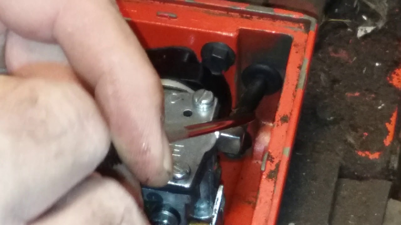 removing the carburetor from a Homelite super xl