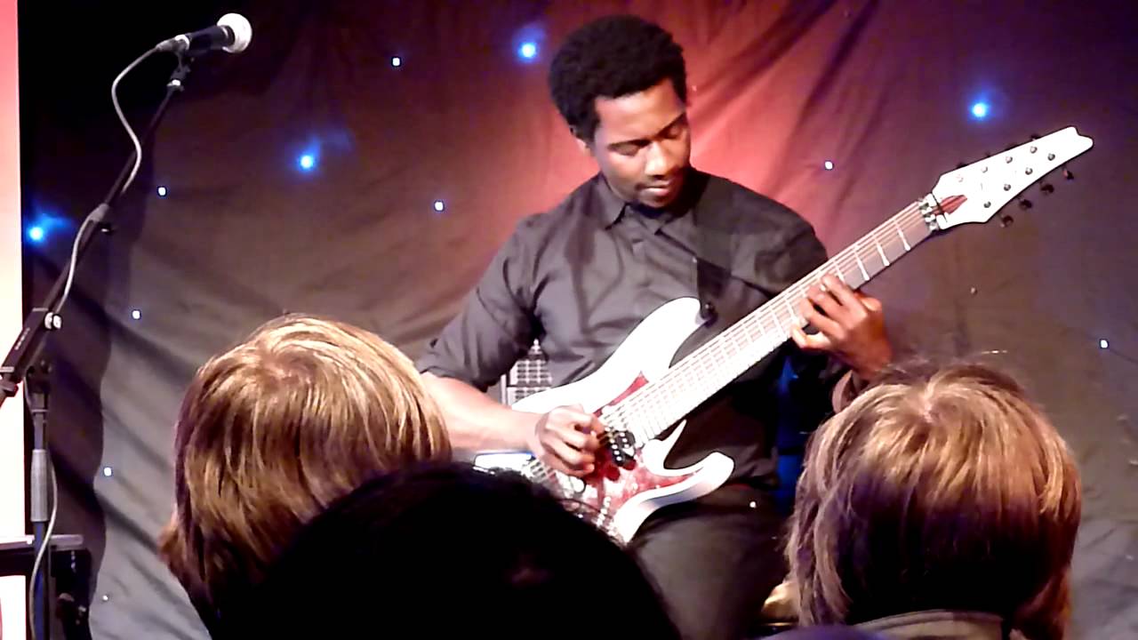 Tosin Abasi performing 