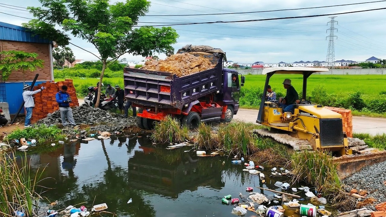 First Start New Project! Landfill on Flooded Area Using Skill Dozer D20P Pushing Soil with Truck