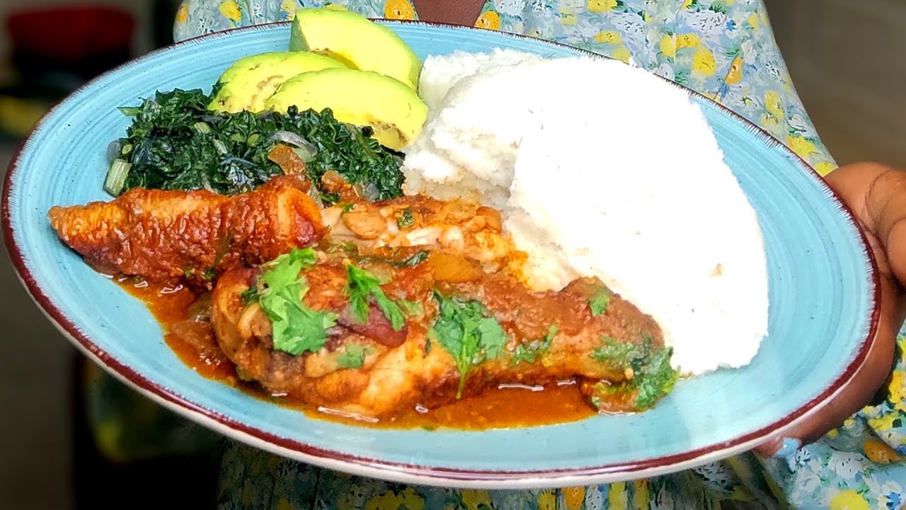 Chicken stew with Kenyan Ugali and spinach.