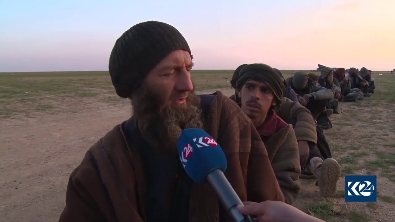 Foreign ISIS fighters talk after surrendering to SDF in Baghouz, Deir al-Zor, Syria