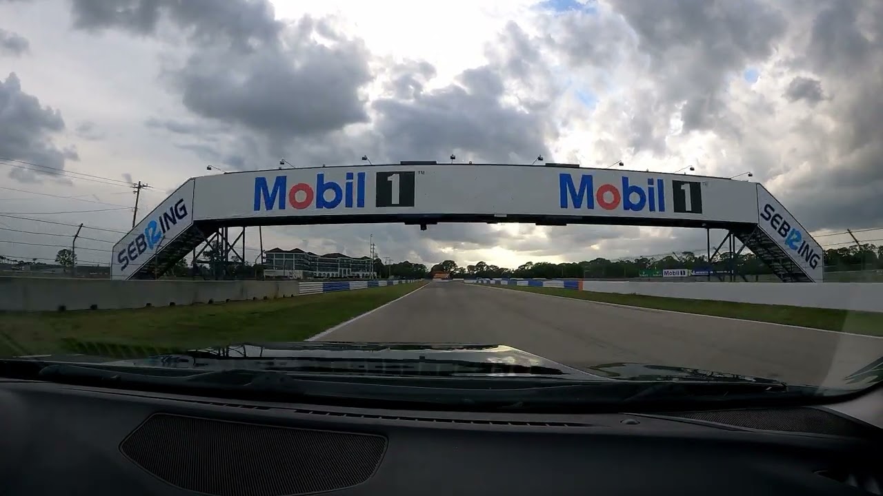 CorkSport 3rd gen turbo Mazda 3 chasing cars at Sebring International