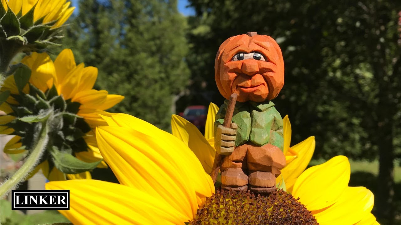 Carving a Pumpkin Head Man