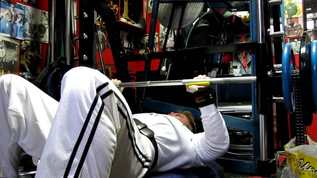 Michael Gundill performs bench press with chains
