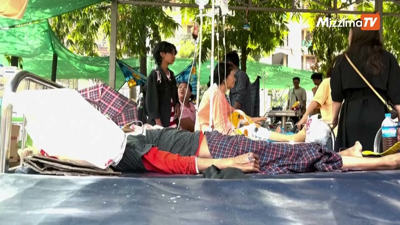 Images from Mandalay general hospital of people being treated outside