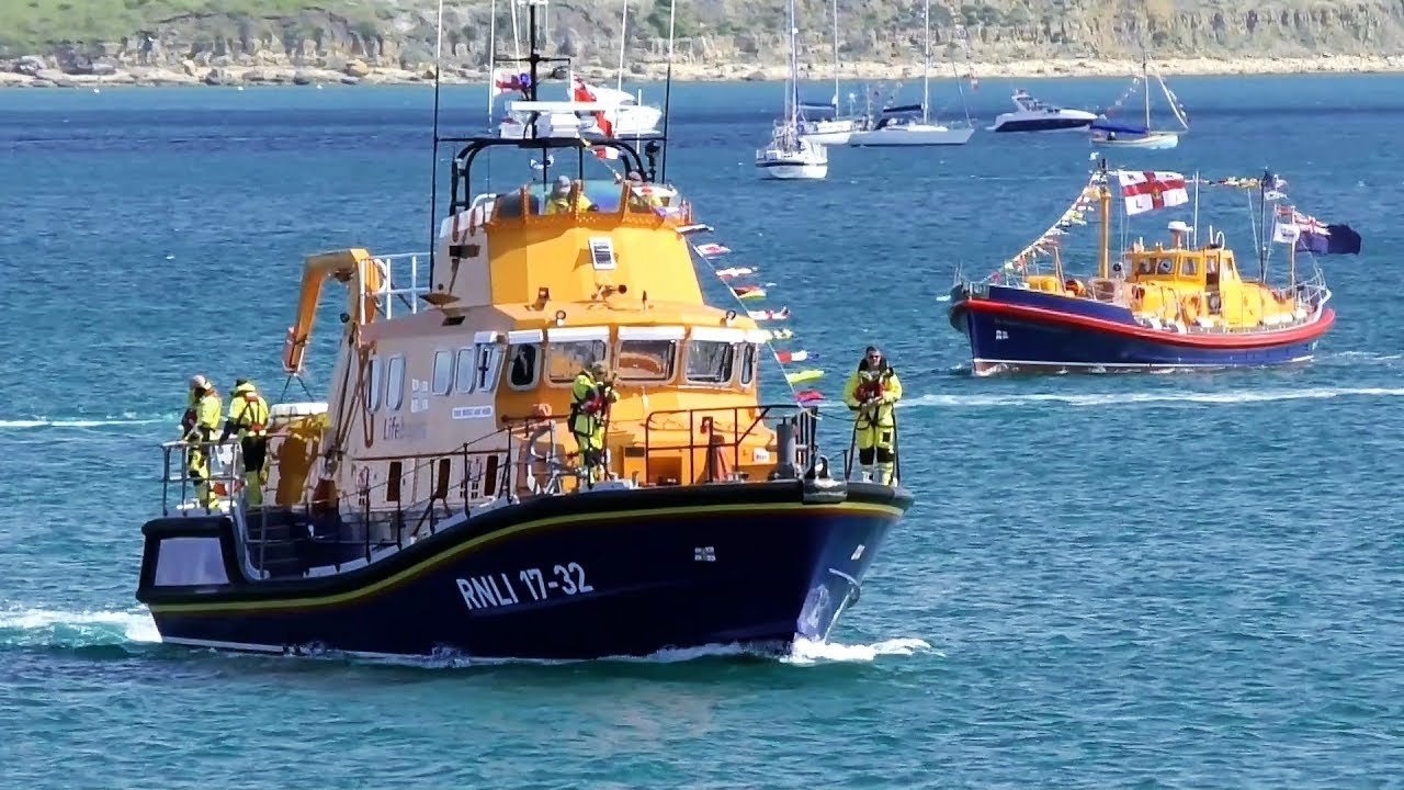 Lifeboats! Weymouth RNLI Station celebrates 150 years. Parade of Boats. Nothe Fort guns.