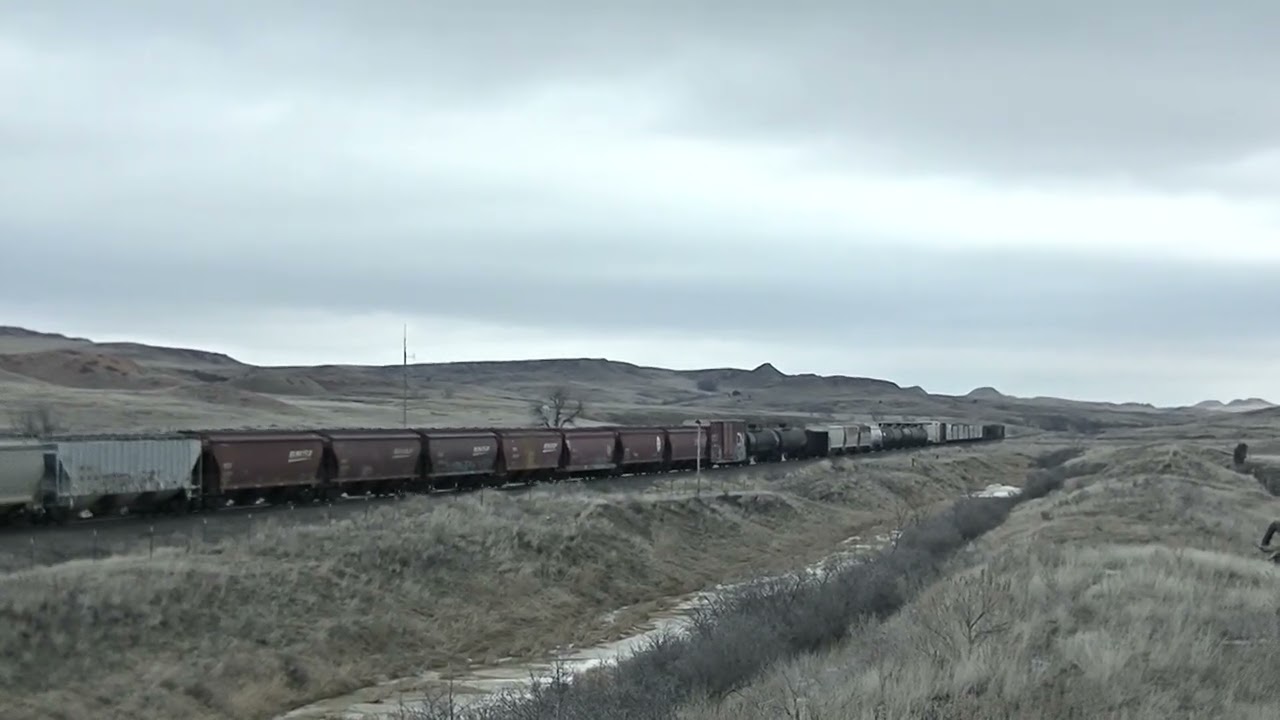 Wind, Noisy wheels and hard working engines climbing up the grade and out of Montana.