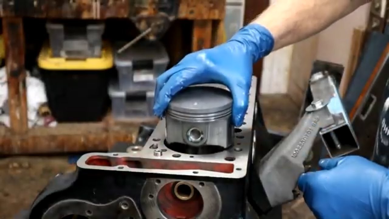 INSTALLING PISTONS ON RODS AND CHECKING PISTON HEIGHT.
