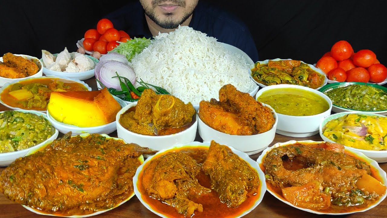 EATING MUTTON CURRY,2 TYPES CHICKEN CURRY,POMFRET FISH,RUI FISH,DAL,3 TYPES BHORTA,PUDDING & SALAD