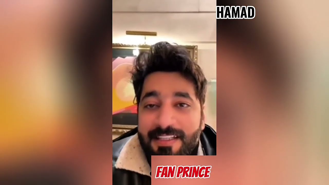 Hamad sits relaxed in his apartment || with his brother.