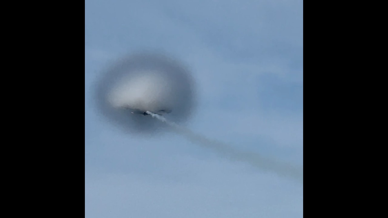 F/A-18 transonic vertical climb with vapor cone by the 