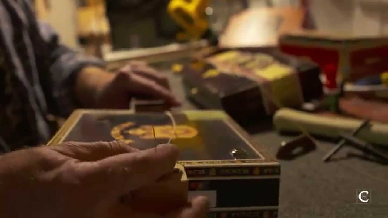 Mike Snowden builds and plays a cigar box guitar