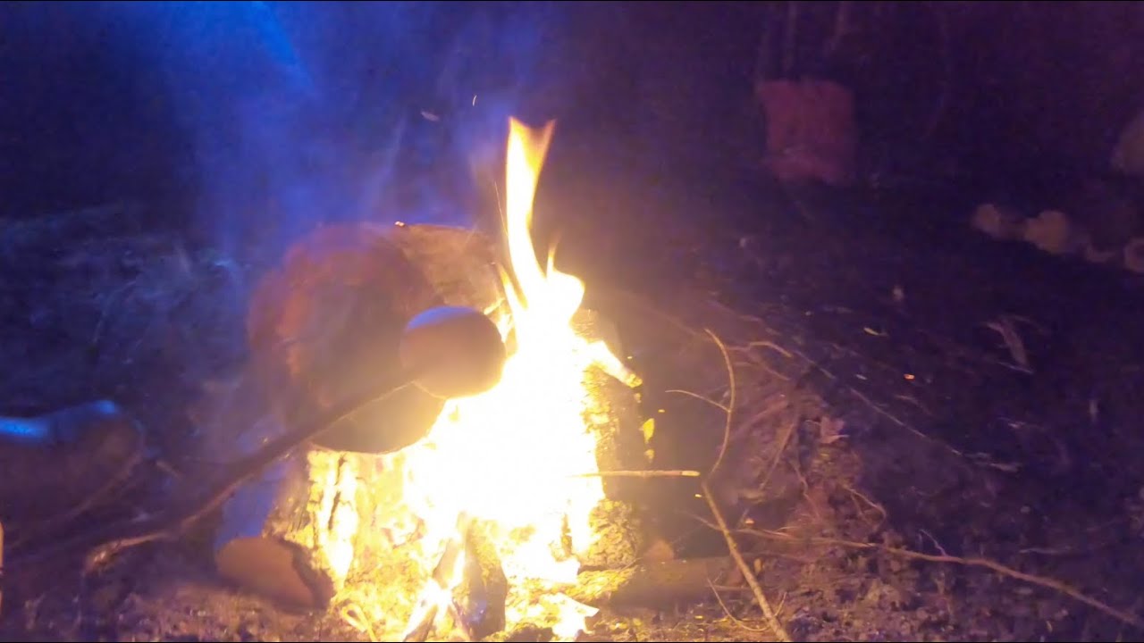 Tarp Shelter with fire pit inside (Bushman Episode)