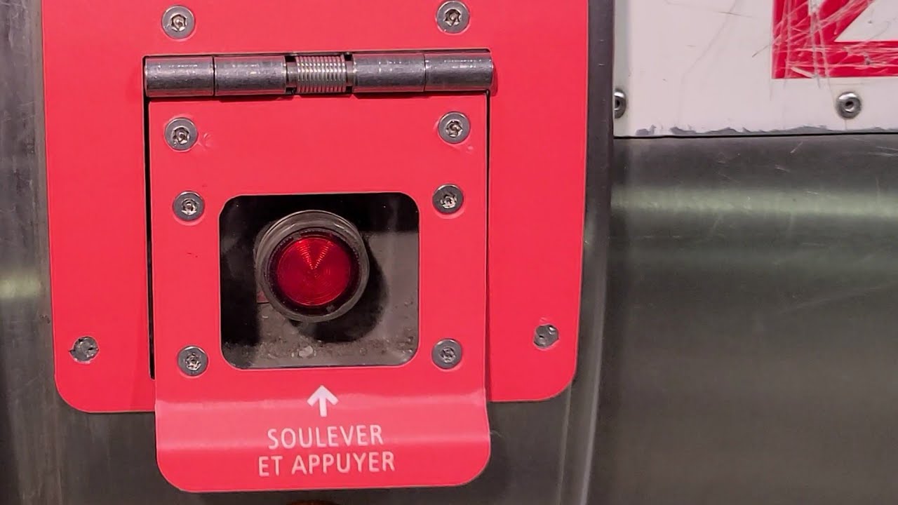 🛑 Demonstrating the new emergency stop button flap on escalators in the Montreal metro system