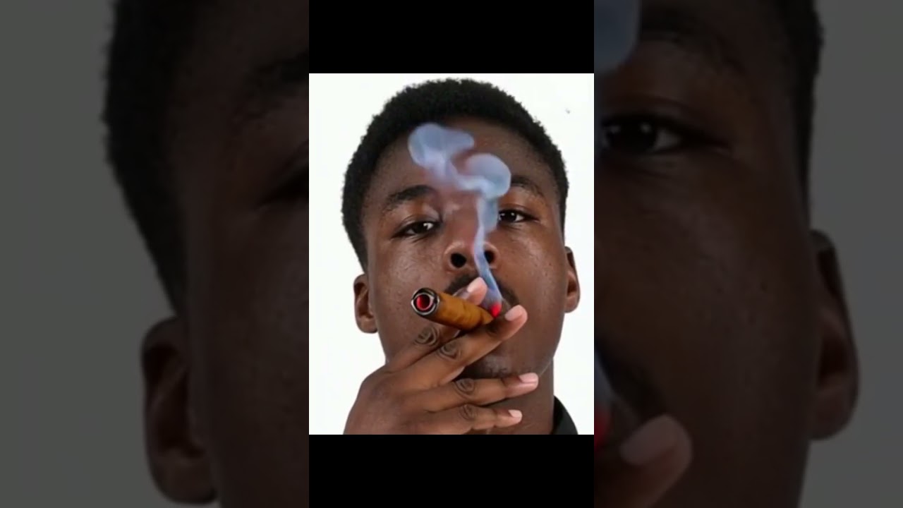 Anthony Musaba Smokes Cigar. 