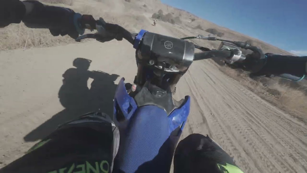 '23 YZ85 chasing a '26 YZ125 on a hard- packed,  but fun track