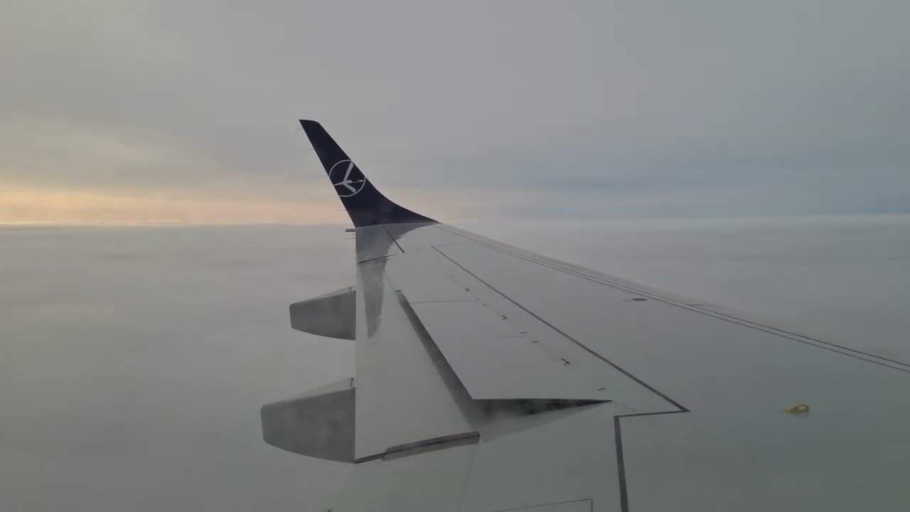 LOT Embraer 195 SP-LNQ landing in Amsterdam